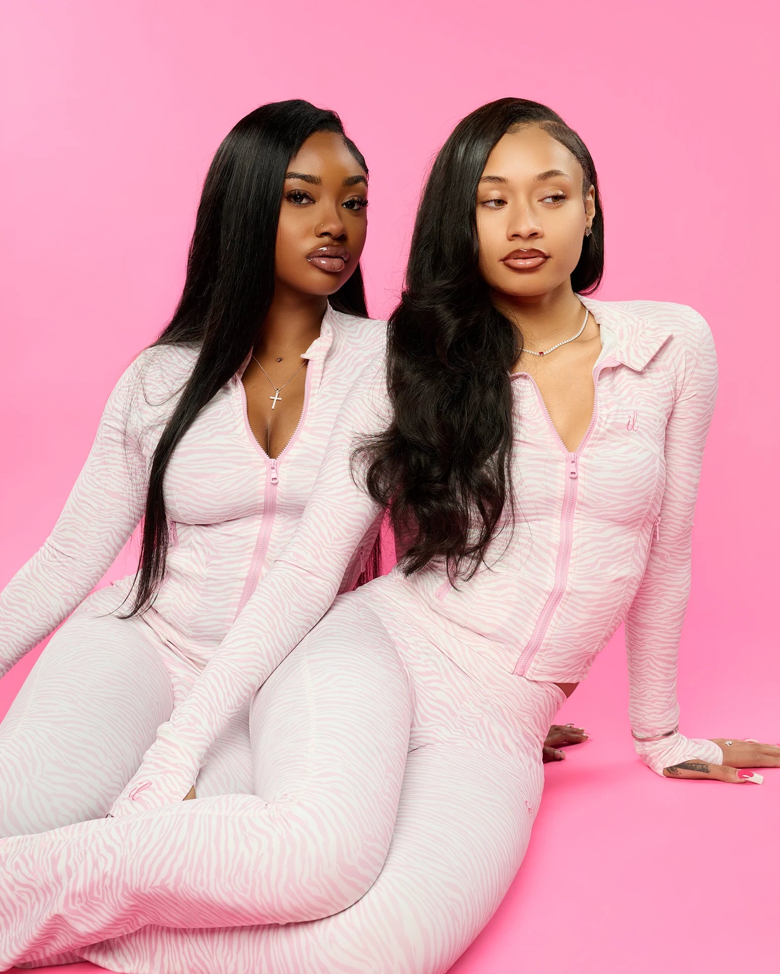 An ILUREIA girl in the pink zebra zip set, the closing frame